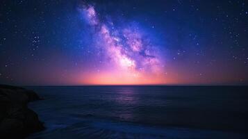 AI generated Milky Way galaxy over the ocean with rocky coastline in the foreground photo