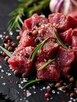 AI generated Raw beef with pepper, rosemary, salt and garlic on a slate plate photo