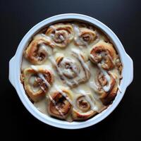 AI generated Homemade cinnamon buns on a dark background photo