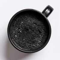 AI generated Black sesame cake in a mug isolated on a white background photo