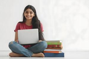 AI generated A young Indian woman sits on the floor with a laptop photo