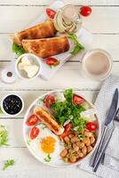 English breakfast. Keto breakfast. Fried egg, beans, chicken sausage and coffee cup. Top view, flat lay photo