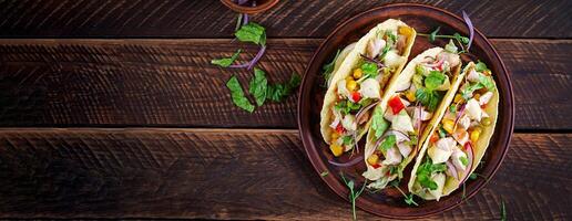 Mexican tacos with chicken meat, corn and salsa. Healthy tacos. Diet menu. Mexican taco. Top view, banner photo