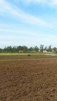 Vertical Video of Tractor in Agriculture Field Aerial View