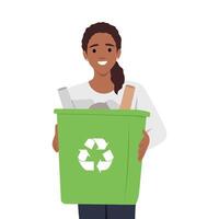 Smiling woman holding a trash can with plastic bottles. vector