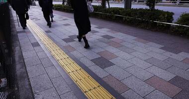 A crowd of walking people leg on the city street video