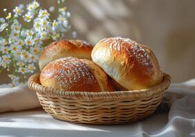 AI generated Fresh buns in wicker basket on white tablecloth with bouquet of daisies photo