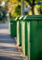 AI generated Green garbage bins in row on the street photo