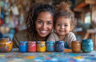 ai generado madre y hija sonrisa a el cámara mientras sentado a mesa con pintar frascos. foto