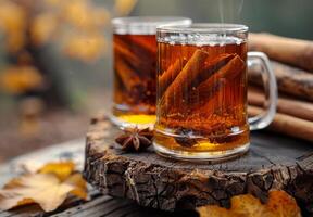 ai generado caliente té con canela palos y anís estrellas en de madera mesa en el otoño bosque foto