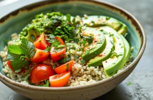 ai generado vegetariano Buda cuenco con quinua aguacate Tomates y hierbas en gris antecedentes parte superior vista. sano comiendo concepto foto