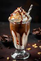 AI generated Delicious ice cream sundae with whipped cream chocolate sauce and caramel topping in tall glass photo