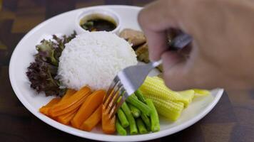 Grilled Beef With Dipping Sauce In White Dish On Wooden Background. Grilled Beef with cooked rice and spicy sauce. video