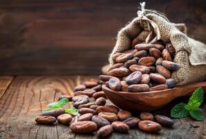 AI generated Cocoa beans in bowl and on table photo