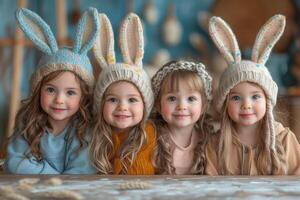 AI generated Four cute little girls in knitted hats with ears of hare sit at the table. The concept of the Easter holidays. photo