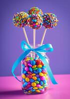 AI generated Colorful cake pops in jar with blue ribbon on purple background photo