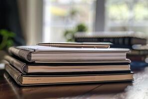 AI generated Pen is placed on top of notebook on wooden table photo