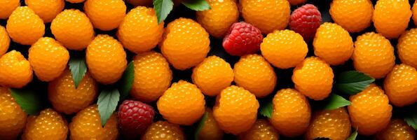 AI generated Fresh and juicy salmonberries as a mouthwatering background banner for food lovers photo