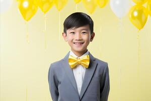 AI generated Asian boy celebrating with festive tie on yellow background, copy space for birthday celebration photo