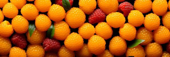 AI generated Delicious fresh salmonberries as a vibrant background banner for summer-themed projects and designs photo
