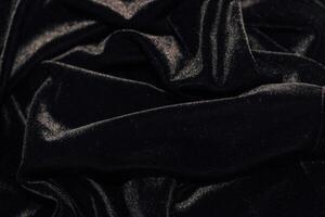 Texture of black velor corduroy fabric with folds. photo