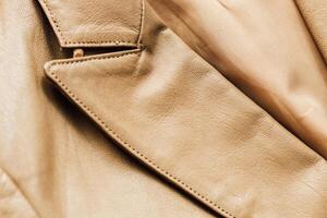 Brown leather jacket texture, genuine soft leather. photo