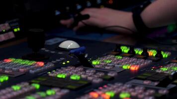 Close up of lit lights of different buttons on the control panel and the controller male hand. Stock footage. Manufacturing machinery and engineering concept. video