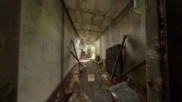 An abandoned hallway filled with scattered items and signs of devastation video