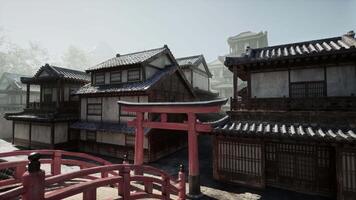 A red gate in front of a row of buildings video