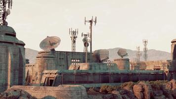 A military base with a heavily fortified building and numerous antennas on top video