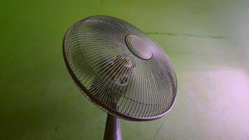 a fan that rotates right and left with dark lighting video