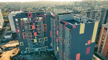 Exterior of a modern design of multistorey apartment building. Aerial view of a multi-colored modern house video
