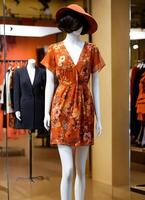 AI generated Fashionable evening orange summer dress on a mannequin. ai generative. ai generative photo