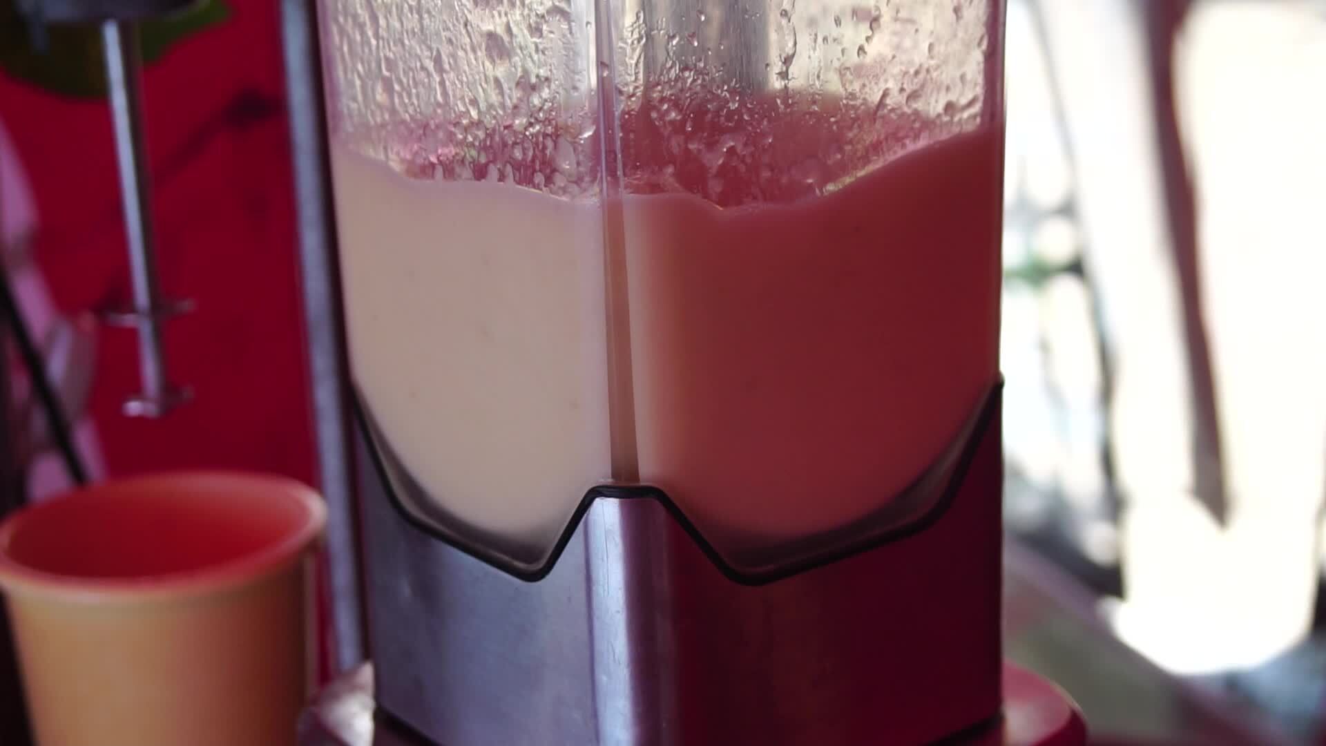 making a fruit cocktail in a blender, smoothies preparation with melon