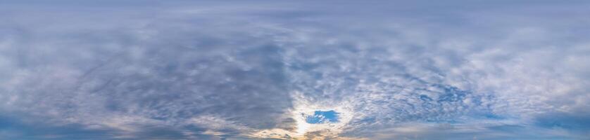 Sunset sky panorama with Stratocumulus clouds in Seamless spherical equirectangular format. Full zenith for use in 3D graphics, game and editing aerial drone 360 degree panoramas for sky replacement. photo