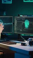Vertical video Man programing sentient artificial intelligence with ethical safeguards against turning evil towards humanity, creation myth concept. Developer building conscious AI superintelligence, camera A