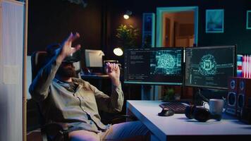 IT expert using virtual reality to make artificial intelligence become sentient, smiling after seeing self awareness signs. Man with VR glasses on happy after achieving AI superintelligence, camera B video