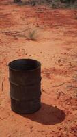 old empty rusted barrel on sand video