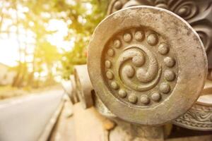 Decorate Japanese ancient of house roof tile in Japan countryside with sun flare and trees background. photo