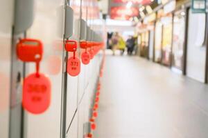 Key of coins locker in Japan railway station on blurry background. Focus on second key photo