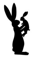 The rabbit holds a baby rabbit in its paws. Rabbit figures in black silhouette vector