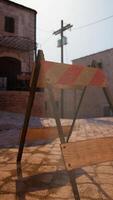 A wooden sign sitting in the middle of a street video