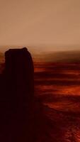 A picture of a desert with a few rocks in the foreground video