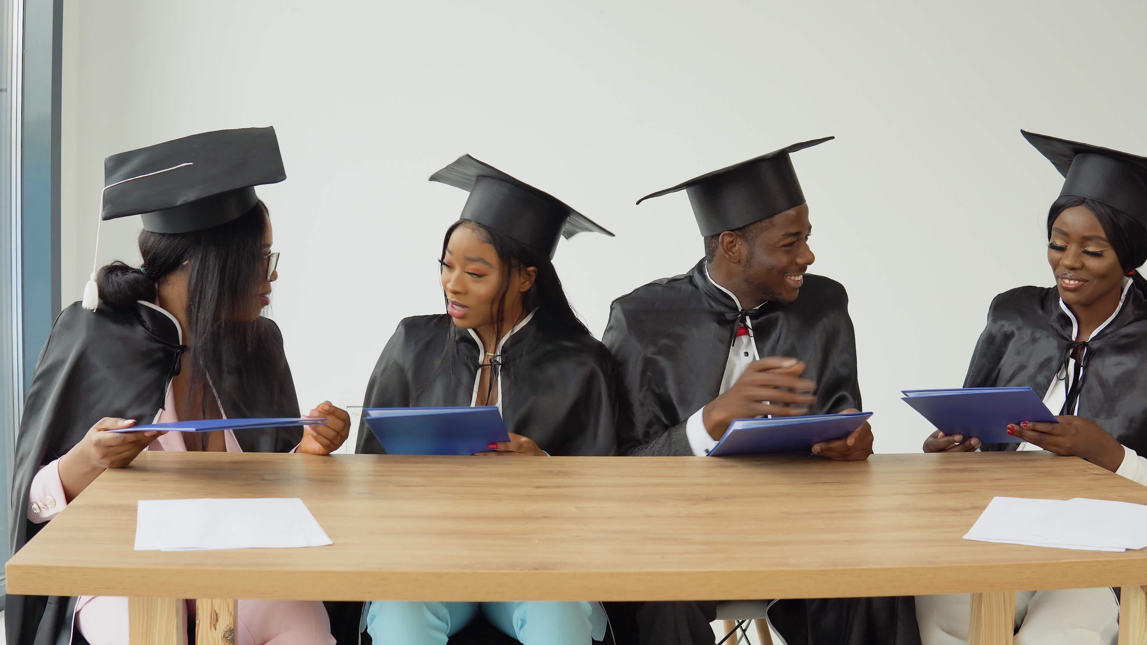 Four graduates of a university or college of African American