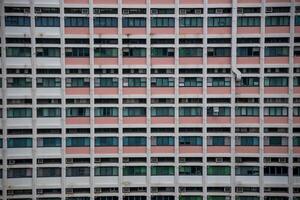 Windows of a building in Hong Kong, China. Hong Kong is one of the most densely populated areas in the world. photo