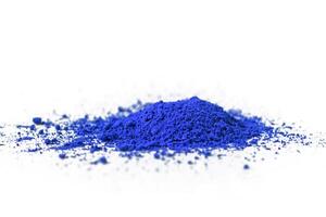 ultramarine pigment, dry paint on a white background, macro photo