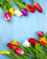 Bouquet of tulips on blue wooden table. Happy women's day. 8 March., Mother's Day. photo