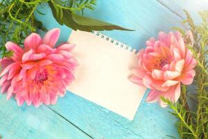 summer background. light pink dahlias on a wooden blue background, photo