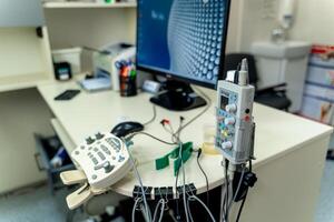 Electromyography equipment. Cropped photo. Medical examination. EMG in modern office. photo