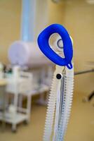 Oxygen mask for a patient. Selective focus with blurred background. photo